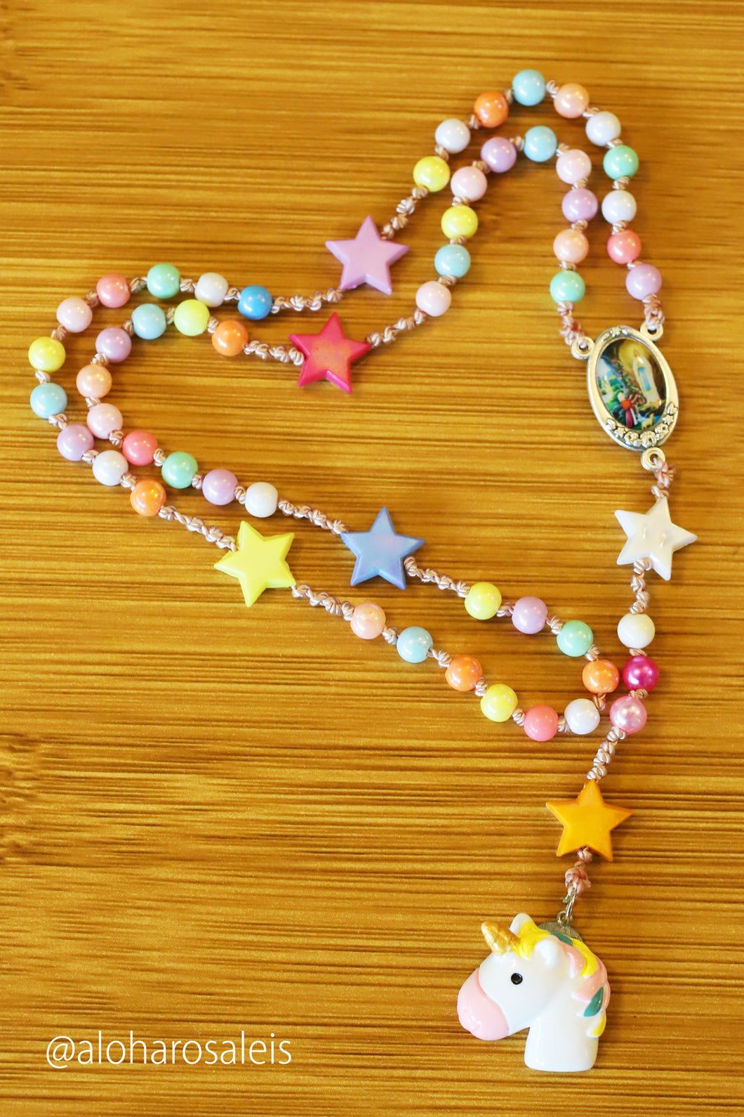 Divine Mother says pray and play! Pastel plastic colored 6mm beads and stars makes this rosary very light and bright. Hand knotted with a touch of unicorn love.